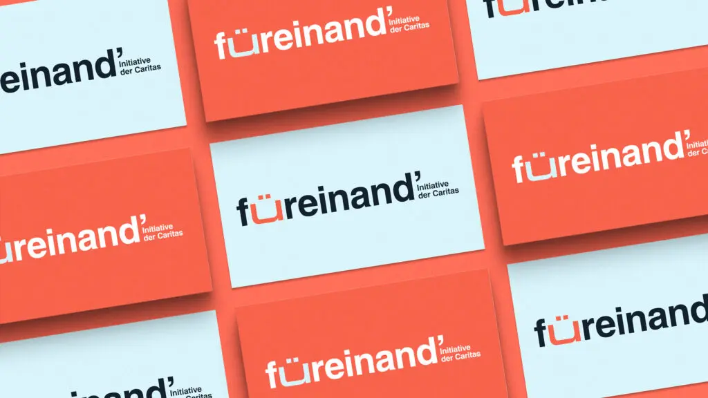 Visitenkarten von füreinand' mit Logo in zwei verschiedenen Farbversionen.